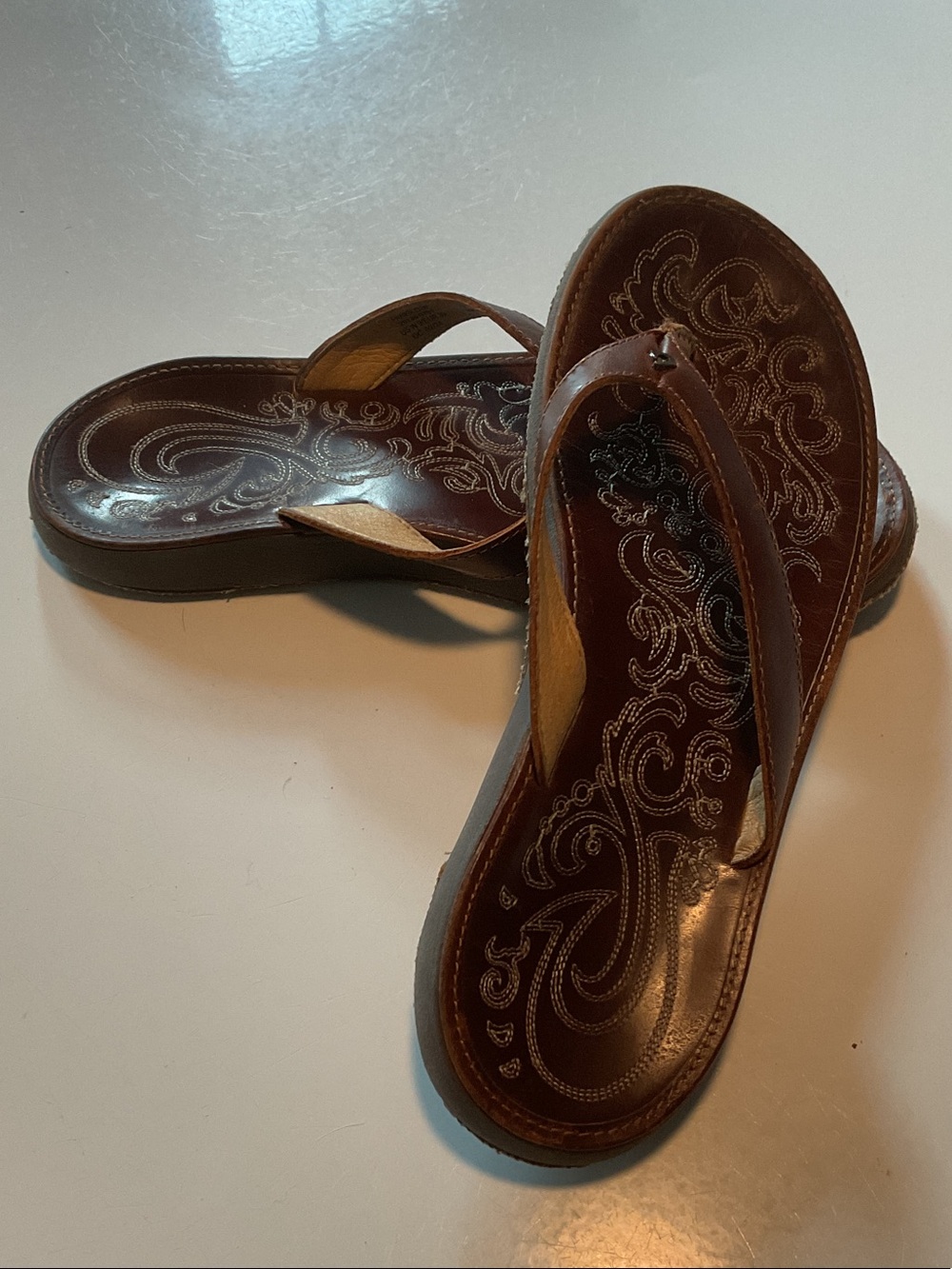 OluKai Brown Leather Embroidered Flip Flop Sandals